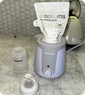 Snookums bottle warmer with milk storage bag and baby bottle accessories