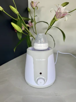 Snookums Electric Bottle Warmer with baby bottle on kitchen counter
