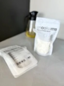 Snookums Breast Milk Storage Bags with sealed storage pouch and filled milk bag